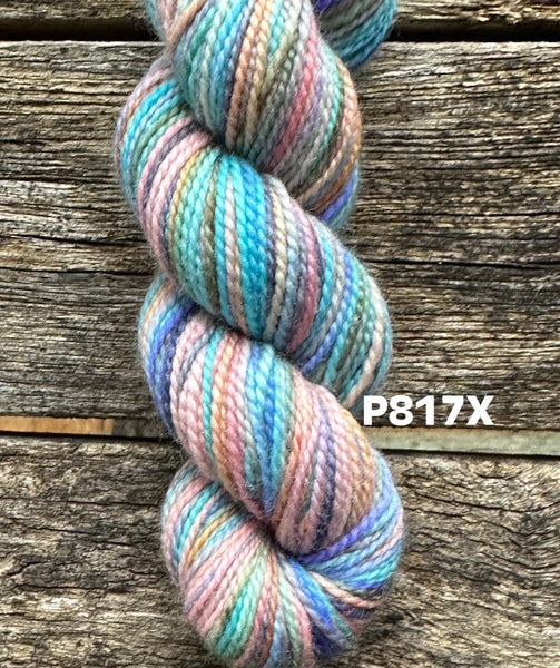 skein of blue, teal, pink, grey, dark blue
