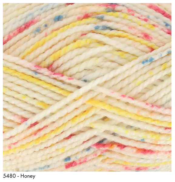 Honey- cream base with sprinkles of blues, yellows, and reds