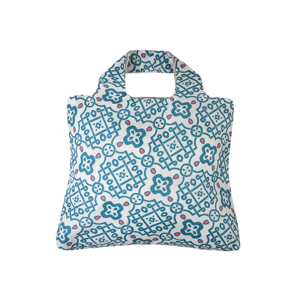 off white bag with light blue and pink designs similar to tile