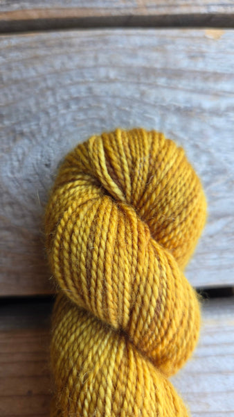 golden yellow skein of yarn