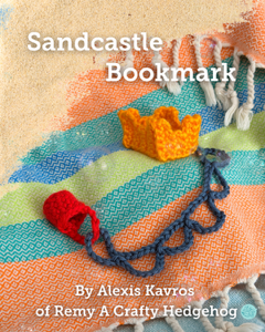 Sandcastle bookmark with colorful sand and towel design, featuring text and branding.