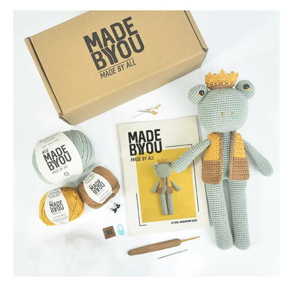 Crochet kit with yarn, pattern, and toy on a white background, featuring 'Made by You' branding.