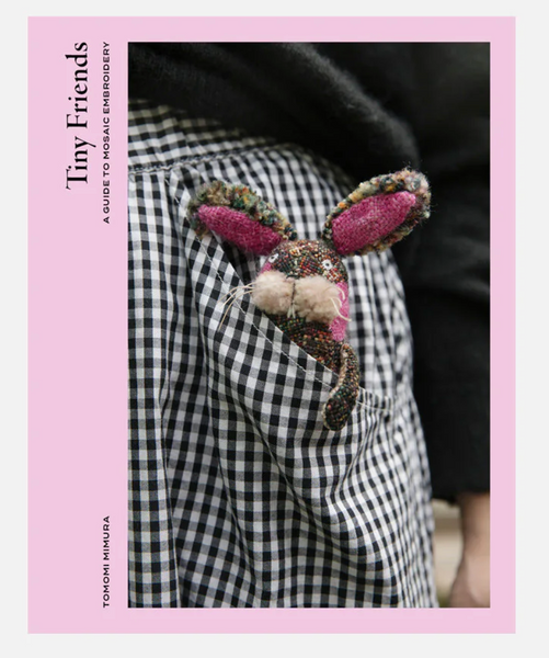 Book cover of 'Tiny Friends' with a checkered jacket and embroidered bunny patch.