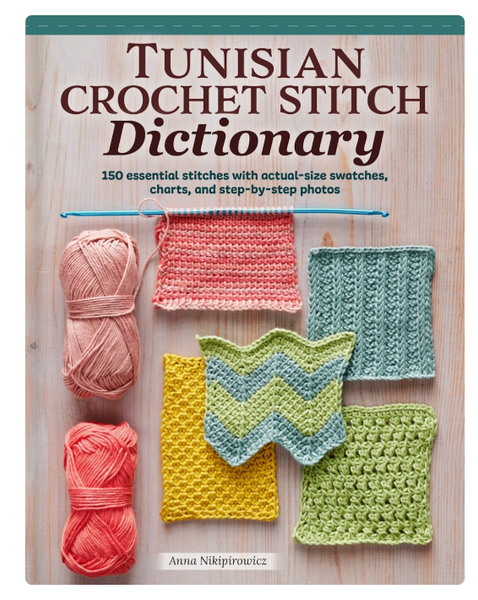 Front cover of the book 'Tunisian Crochet Stitch Dictionary' by Anna Nikiptirouicz, featuring a light wood background with crochet swatches in pink, teal, yellow, and green, plus two skeins of yarn on the left.