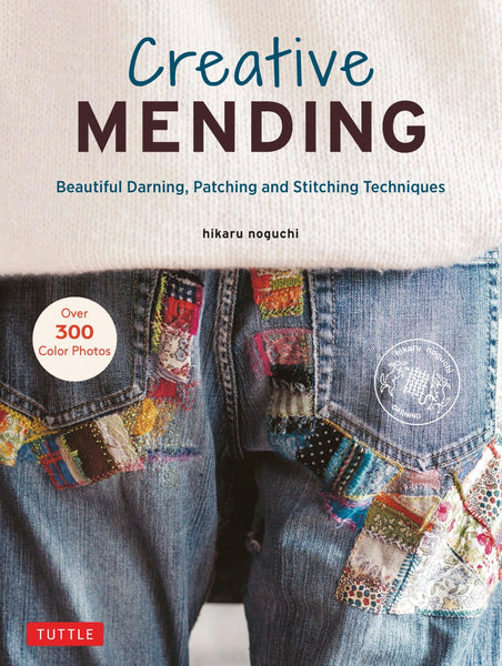 Book cover of 'Creative Mending' with colorful patchwork jeans and Tuttle Publishing logo.
