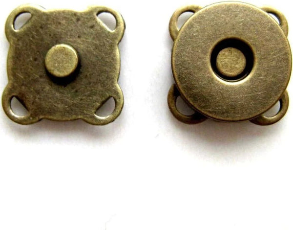 Two antique bronze magnetic snaps shown on a plain white background, displaying both the front and back views.